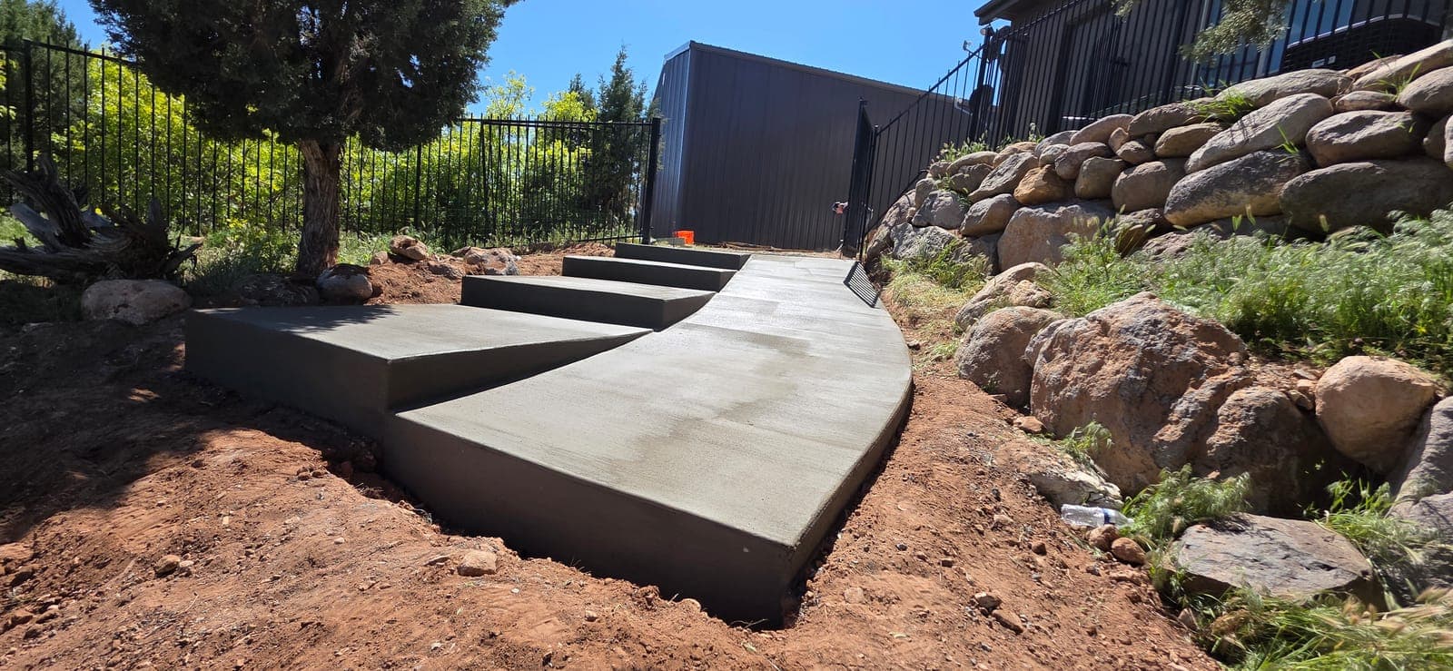 Curved walkway with floating steps by Montara Forge